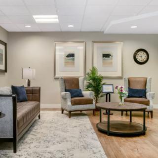 A cozy and elegantly designed living room with comfortable seating and tasteful decor.
