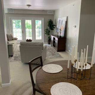 A beautifully designed open living and dining space featuring modern furniture and natural light.