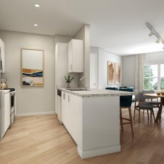 Modern open-concept kitchen and dining area with natural light.