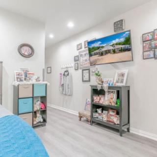 A modern living room with a television and stylish decorations.
