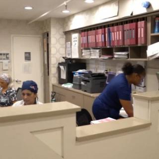 Medical office staff working at their desks.
