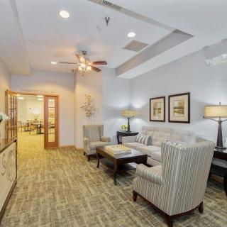 A modern living room with elegant furniture and decor.