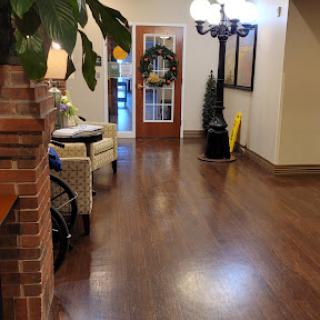 A welcoming lobby area with stylish decor and wooden flooring.