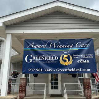 A banner promoting 'Award Winning Care' at a Greenfield facility.