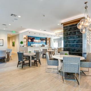 A modern lounge area with seating and ambient lighting.
