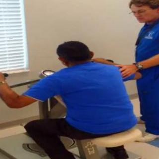 A person receiving guidance during a physical therapy session.