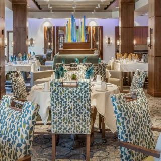An elegant dining area with modern decor and stylish chairs.
