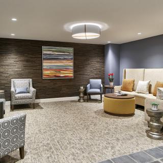 A modern lobby with comfortable seating and contemporary artwork.
