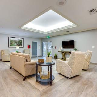 A modern living room with comfortable seating, a TV, and tasteful decor.