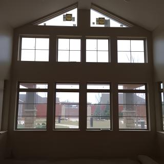 Interior view of a large set of windows, showcasing architectural design.