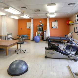 A well-equipped physical therapy room designed for rehabilitation and exercise.