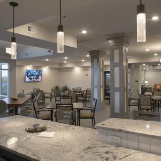 A modern dining area with stylish lighting and comfortable seating arrangements.