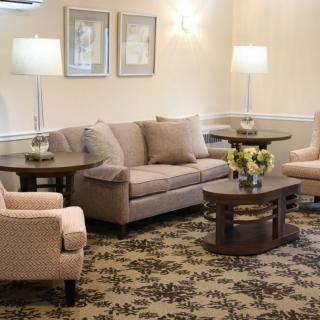 Cozy living room with comfortable seating and soft lighting.