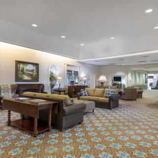 A spacious lobby area with comfortable seating and elegant decor.