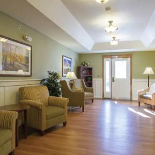 A well-lit waiting room with comfortable seating and tasteful decor.