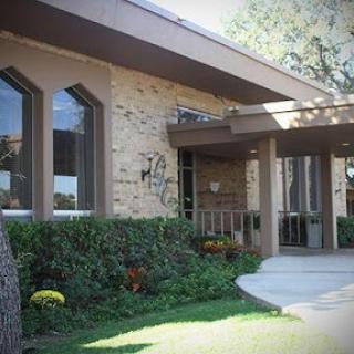 A contemporary house with an inviting entrance and landscaped garden.