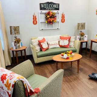 A cozy living room adorned with autumn decorations, perfect for welcoming guests.