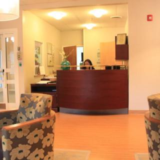 A welcoming reception area with a desk and seating for visitors.