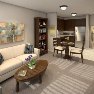 A cozy living and dining area with modern furnishings and neutral tones.