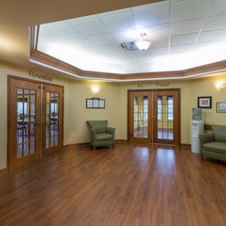 A welcoming lobby space with wooden flooring and comfortable seating.