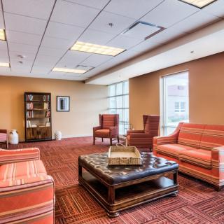 A comfortable lobby area with seating and a coffee table.