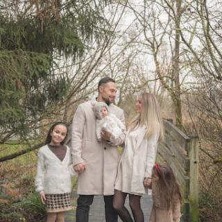 A beautiful family moment captured in nature, embracing the joy of togetherness.