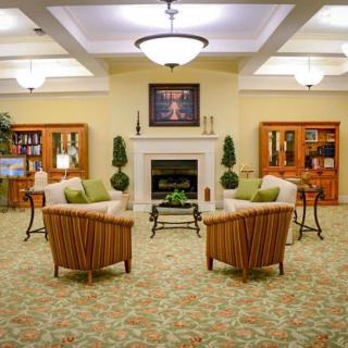 A cozy living room with comfortable seating and a fireplace.