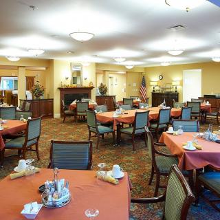 A well-decorated dining room with tables set for a meal.
