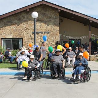 Residents enjoying a vibrant community celebration outdoors.