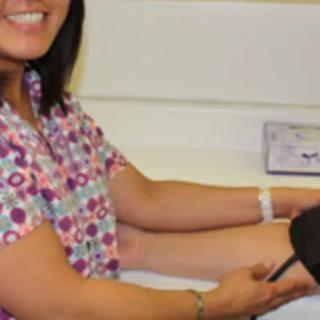 A healthcare professional is measuring a patients blood pressure.