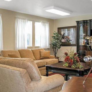 A cozy living room with comfortable seating and natural lighting.