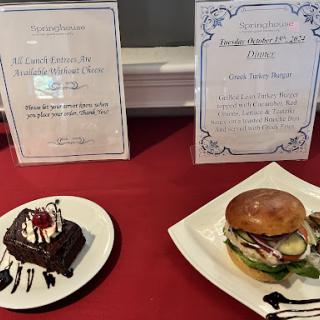 A delightful display of a chocolate dessert and a burger, accompanied by menu descriptions.