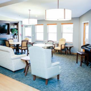 A beautifully designed living room featuring comfortable seating and ample natural light.