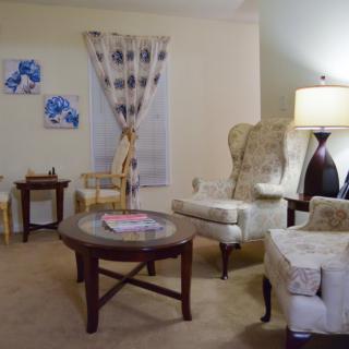 A cozy living room with elegant furniture and warm lighting.