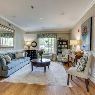 A cozy and elegantly decorated living room with comfortable seating and stylish decor.