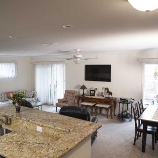 A modern open-concept living and dining area with a kitchen island.