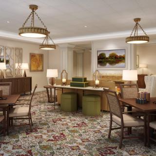 A traditional dining room with wooden furniture, chandeliers, and a patterned carpet.