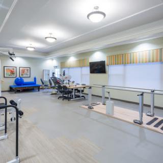 A spacious and well-equipped rehabilitation gym designed for fitness and therapy.