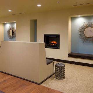 A modern interior with a cozy fireplace and minimalist decor.