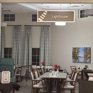 A cozy dining area featuring neatly arranged tables and elegant decor.