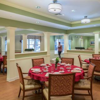 A well-decorated dining area with set tables and comfortable seating.