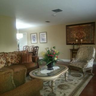A cozy living room with classic furniture and elegant decor.