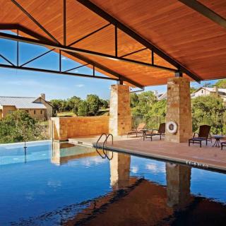 An indoor pool with a scenic outdoor view, perfect for relaxation.