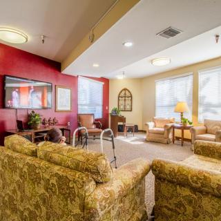 A cozy living room with comfortable sofas and ample natural light.
