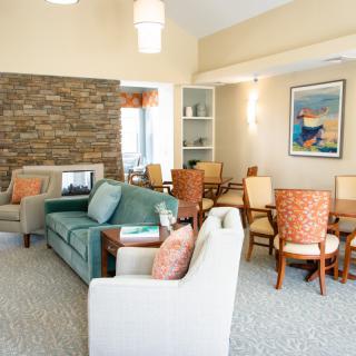 A cozy living room with comfortable seating and a fireplace.