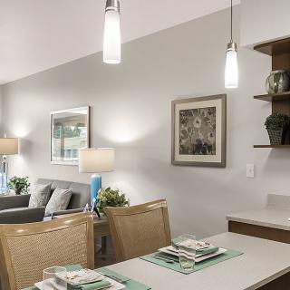 A modern dining area with stylish lighting and decor.