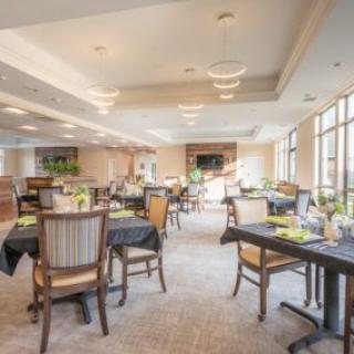 Elegant and spacious dining area with neatly arranged tables and chairs.