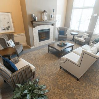 A cozy living room with elegant furniture and a fireplace.