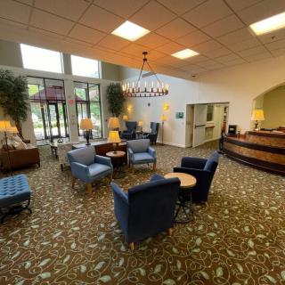 A spacious lobby with comfortable seating and a welcoming atmosphere.