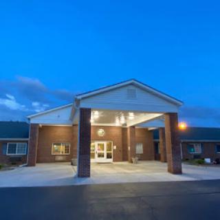 An inviting entrance of a building illuminated at dusk.
